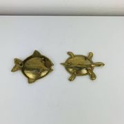 Pair of animal trinket trays in brass, fish and turtle.