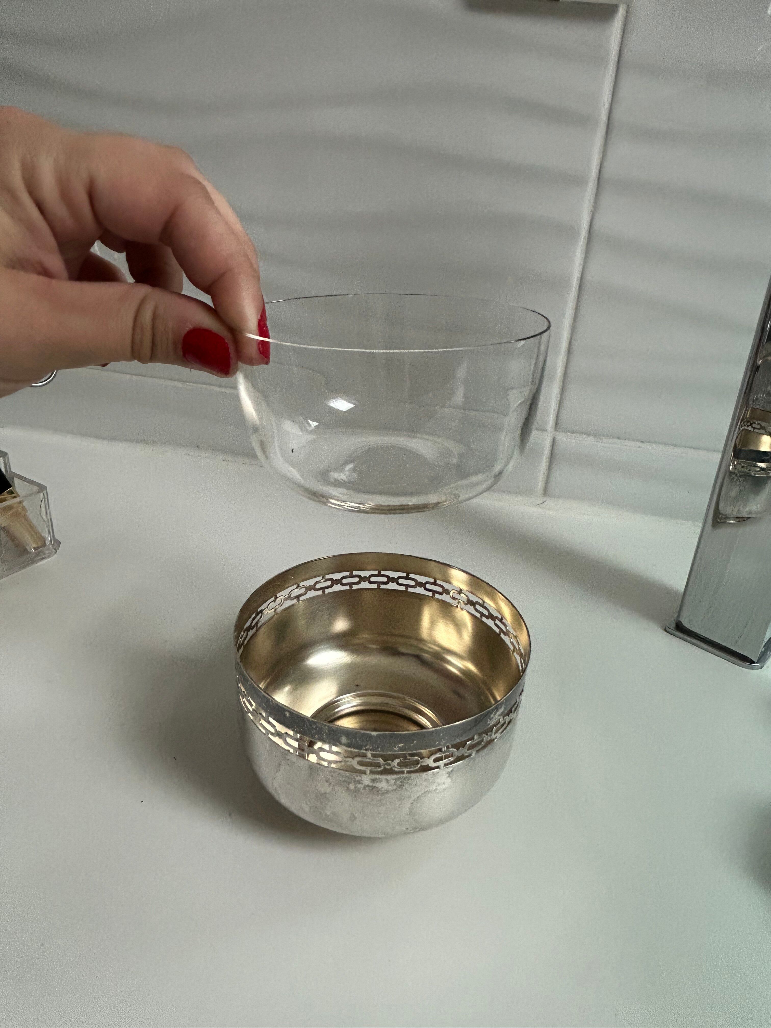 Vintage silver cup with a glass interior.