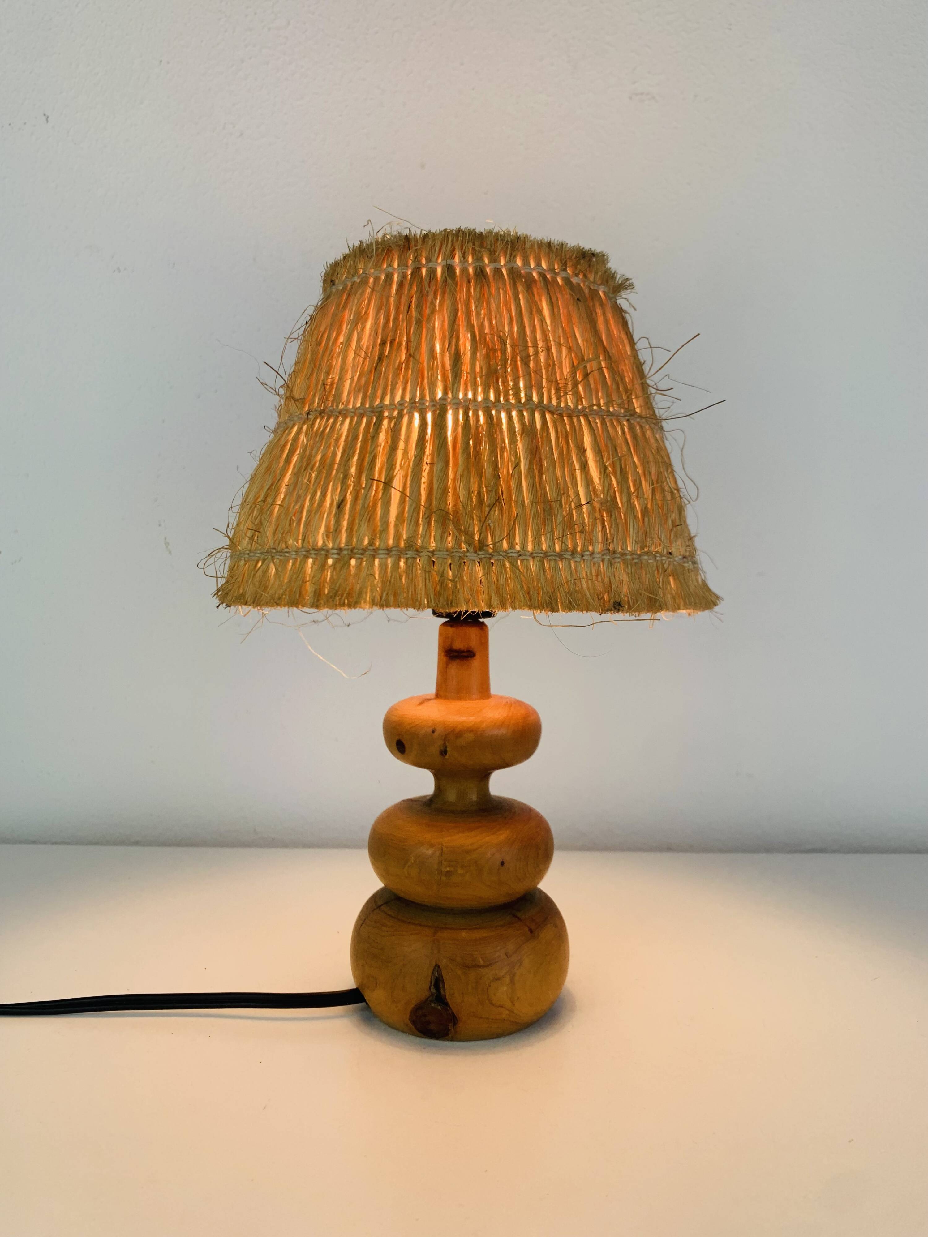 Turned wood lamp with straw shade, 1960s, vintage
