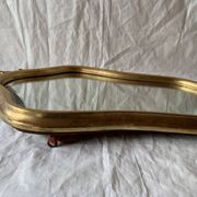 Ancien miroir mural biseauté en bois massif doré