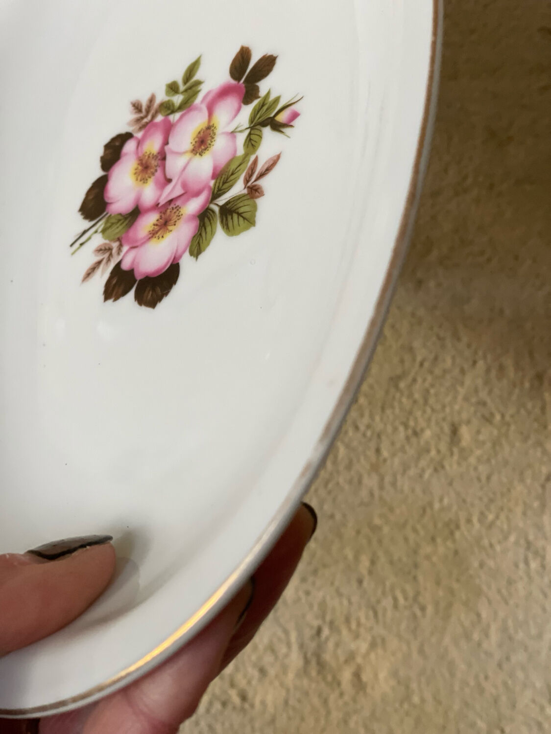 2 oval porcelain dishes with a floral pattern