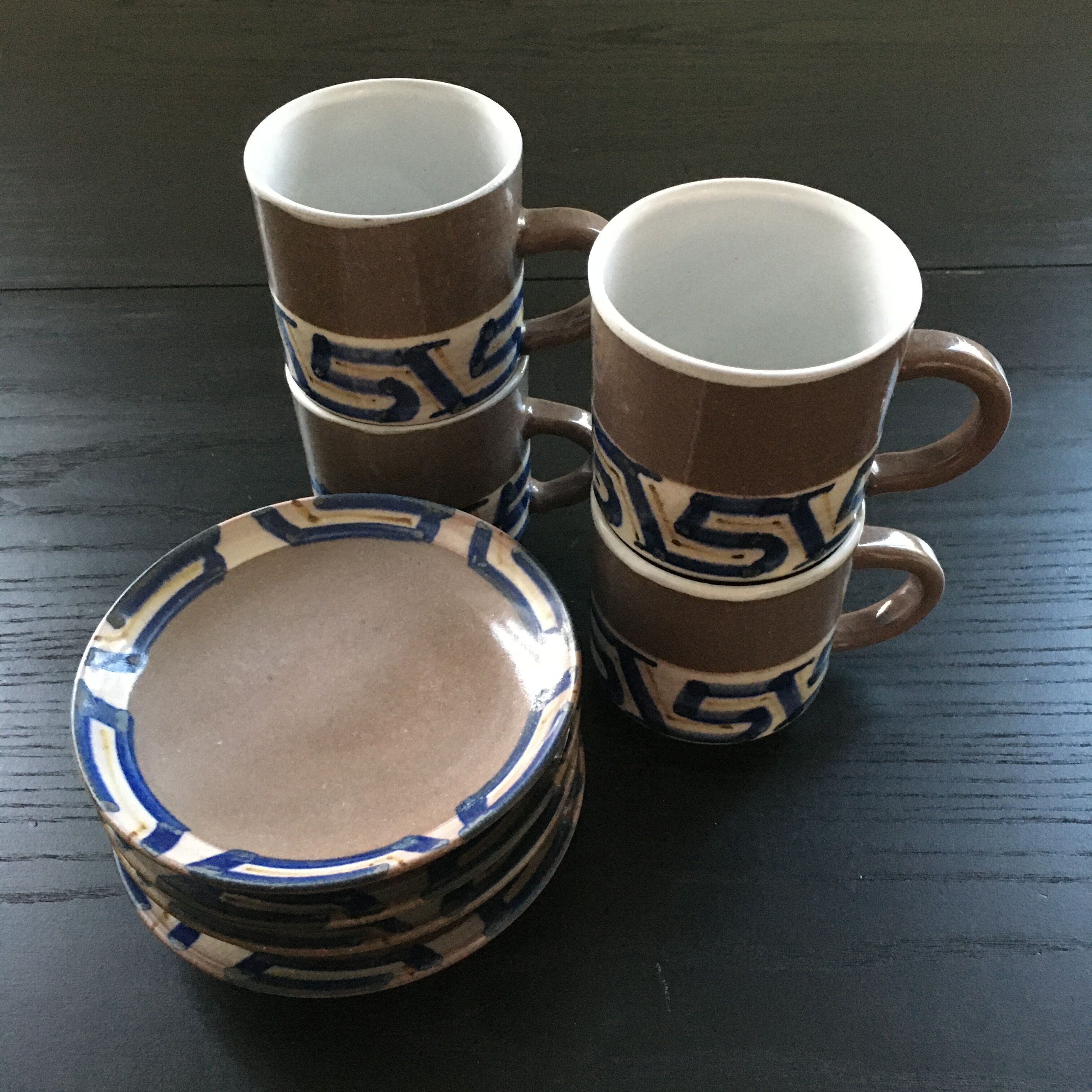 Set of 4 brown stoneware mugs and saucers with blue decor