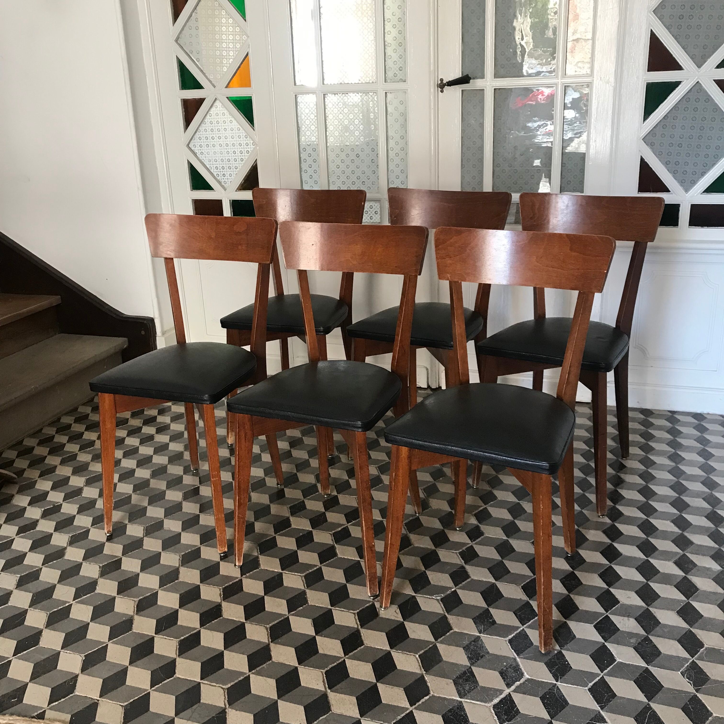 Vintage wooden and black skai chairs