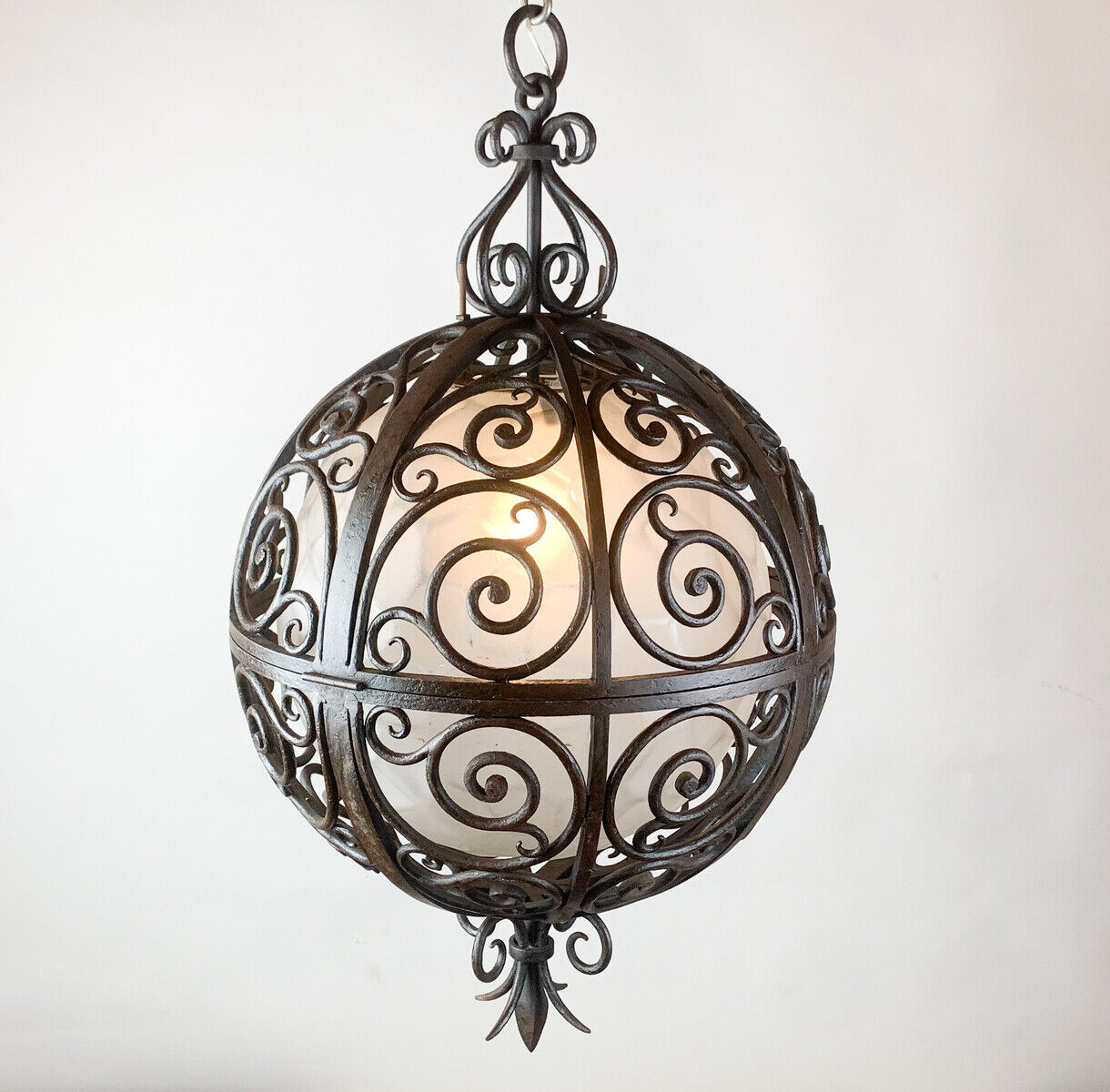 Wrought iron round suspension with interior glass sphere, c.1930
