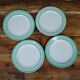 Set of 4 KIFO L'Amandinoise flat plates with green leaf design.