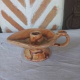 Vintage candle holder in the shape of a stylized Aladdin lamp