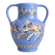 Glazed blue ceramic vase with folk decoration