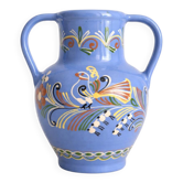 Glazed blue ceramic vase with folk decoration