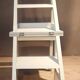 White chair convertible into a staircase.