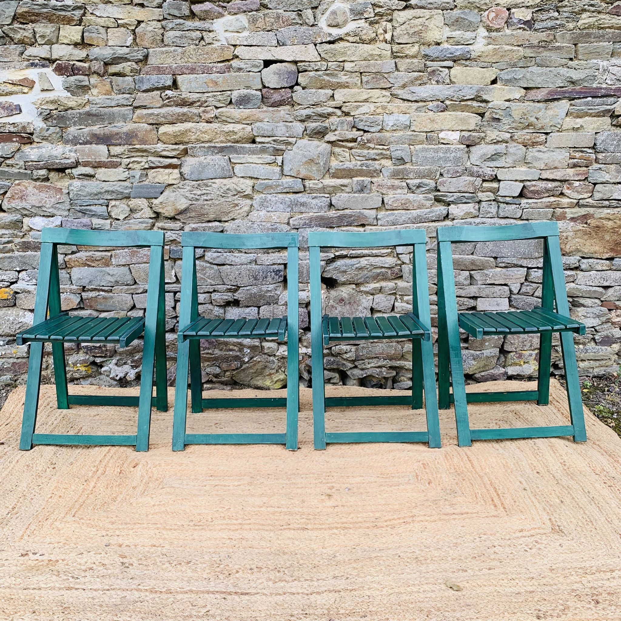 Set of 4 green folding chairs