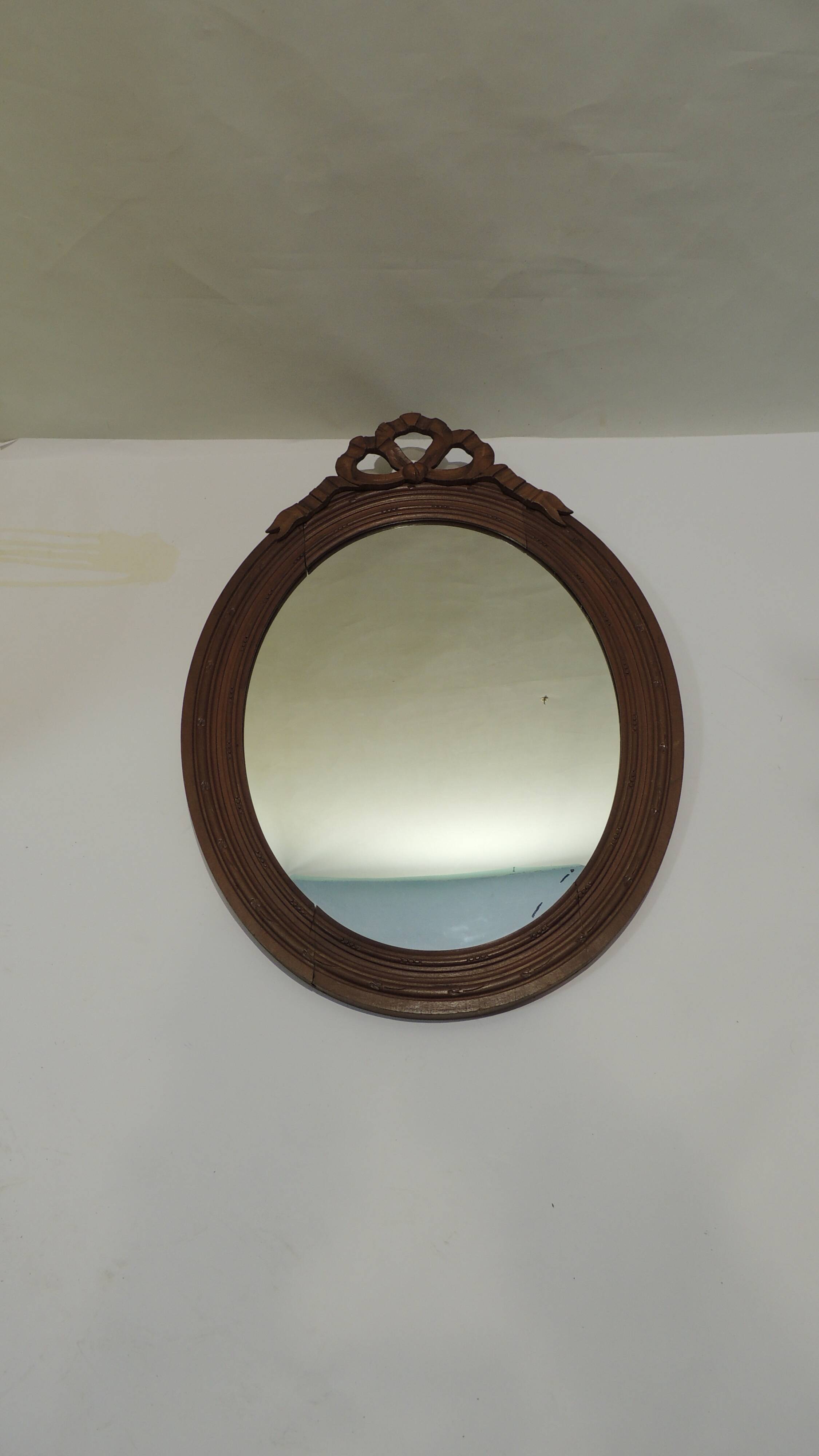 Antique oval mirror in carved wood – Louis XVI style, ribbon bow decoration, mid