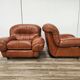 2 fauteuils en cuir cognac, années 1970