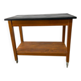 Vintage wooden high table on wheels