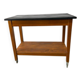 Vintage wooden high table on wheels