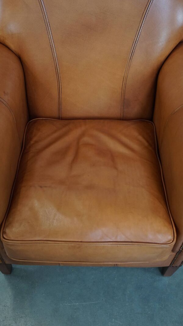 Fauteuil en cuir de vachette couleur cognac