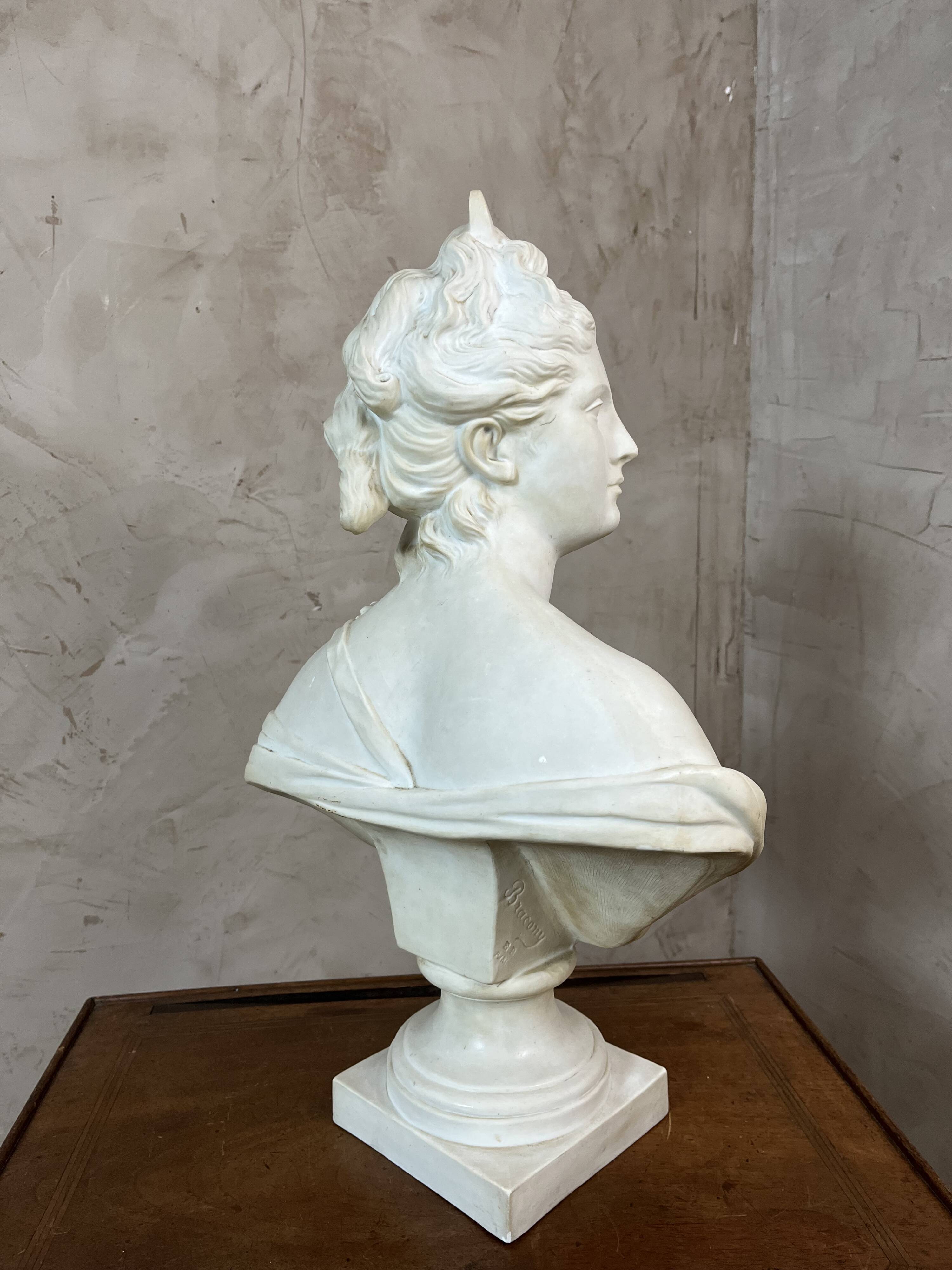 Bust of a woman in Biscuit signed