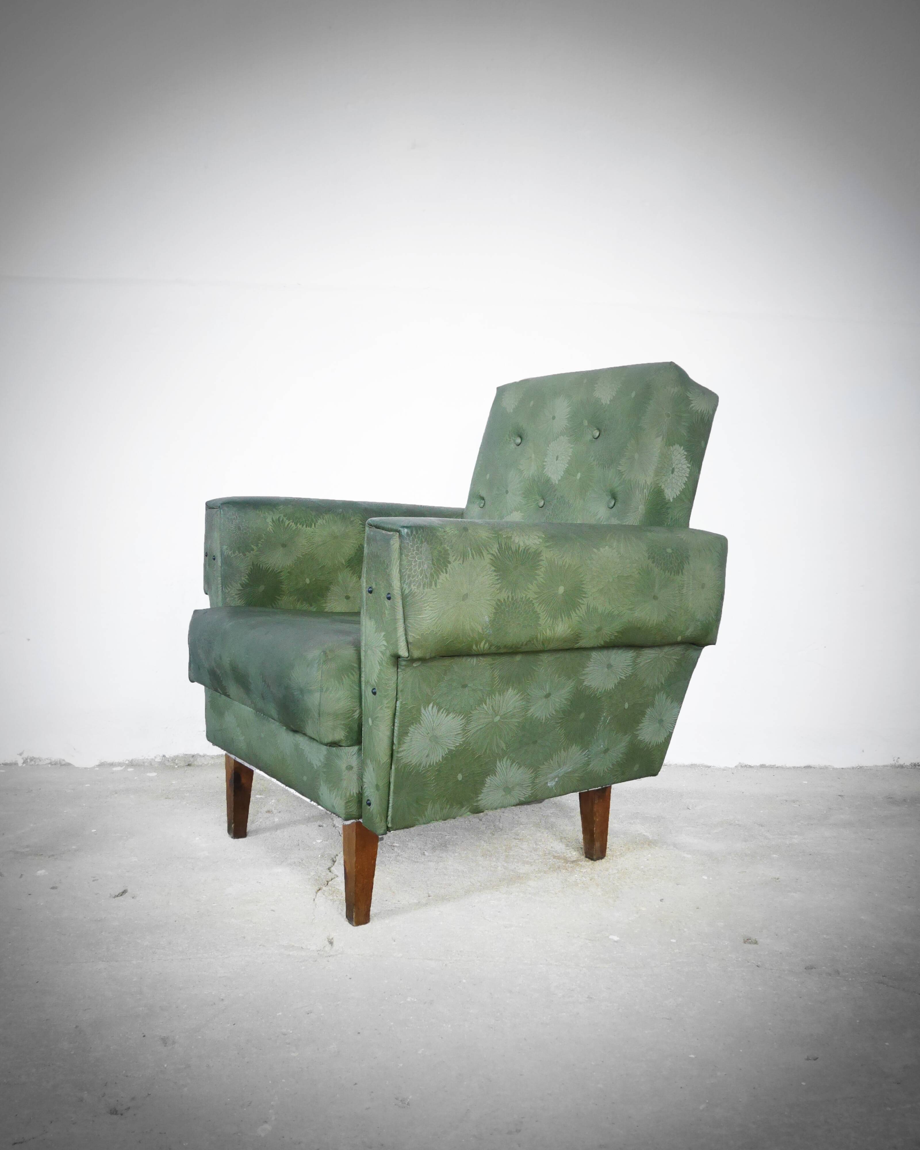 Green armchair in leatherette