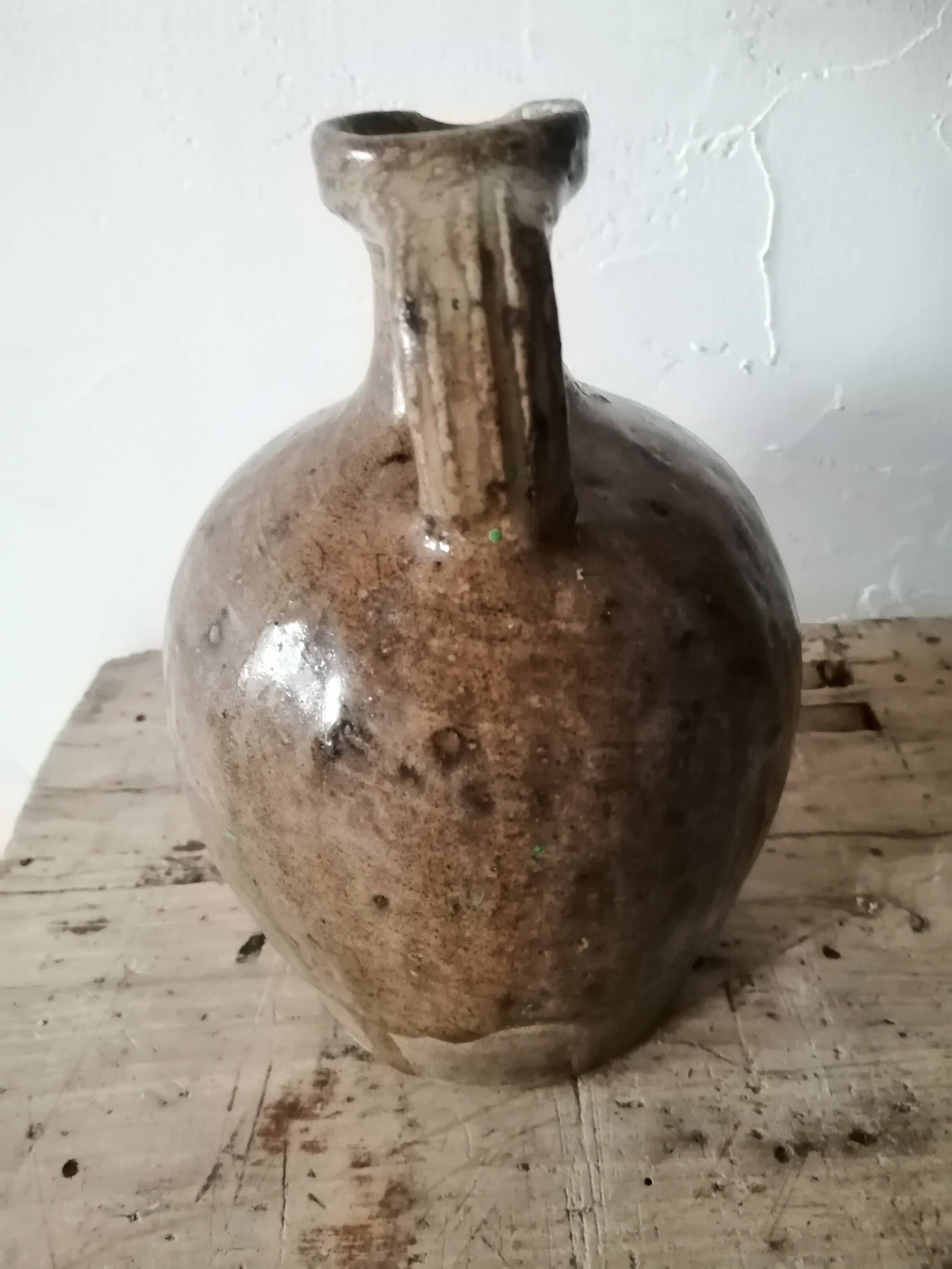 Small very old glazed jug