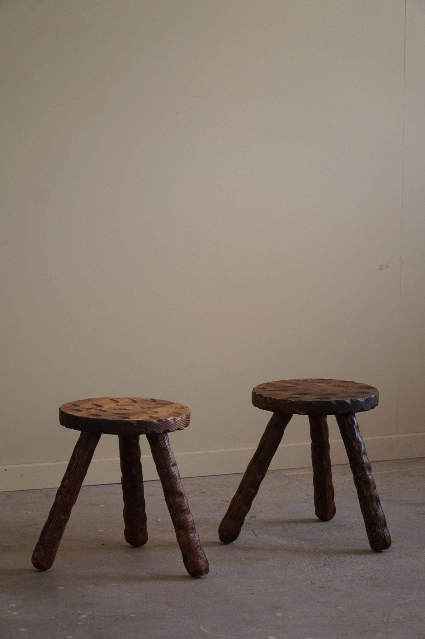 A pair of Wabi Sabi stools carved from pine, mid-century modern Swedish style, 1960s.