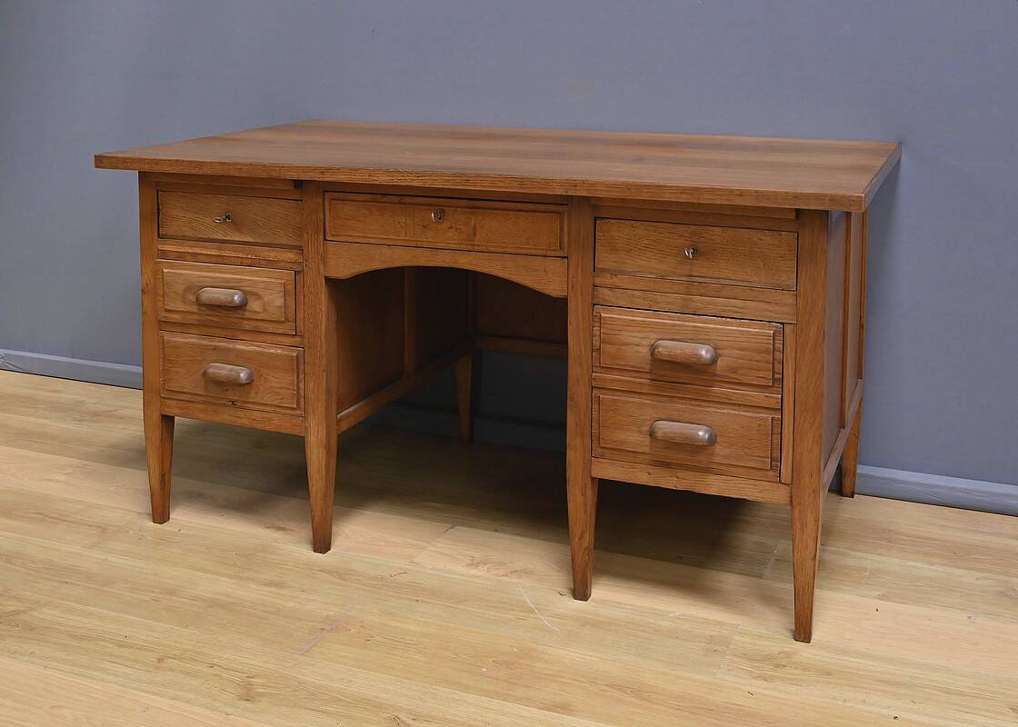 Solid oak pedestal desk, Régy establishments – 1940