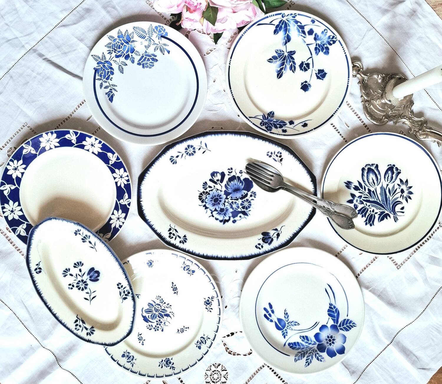 Mismatched antique flat plates accompanied by dishes.