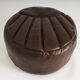 Pouf en cuir vintage