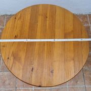 Scandinavian coffee table in solid pine with tripod legs in Swedish chalet style.