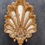 Palm-shaped faceted mirror