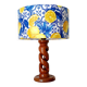 Turned wooden lamp with a lampshade featuring lemon tiles.