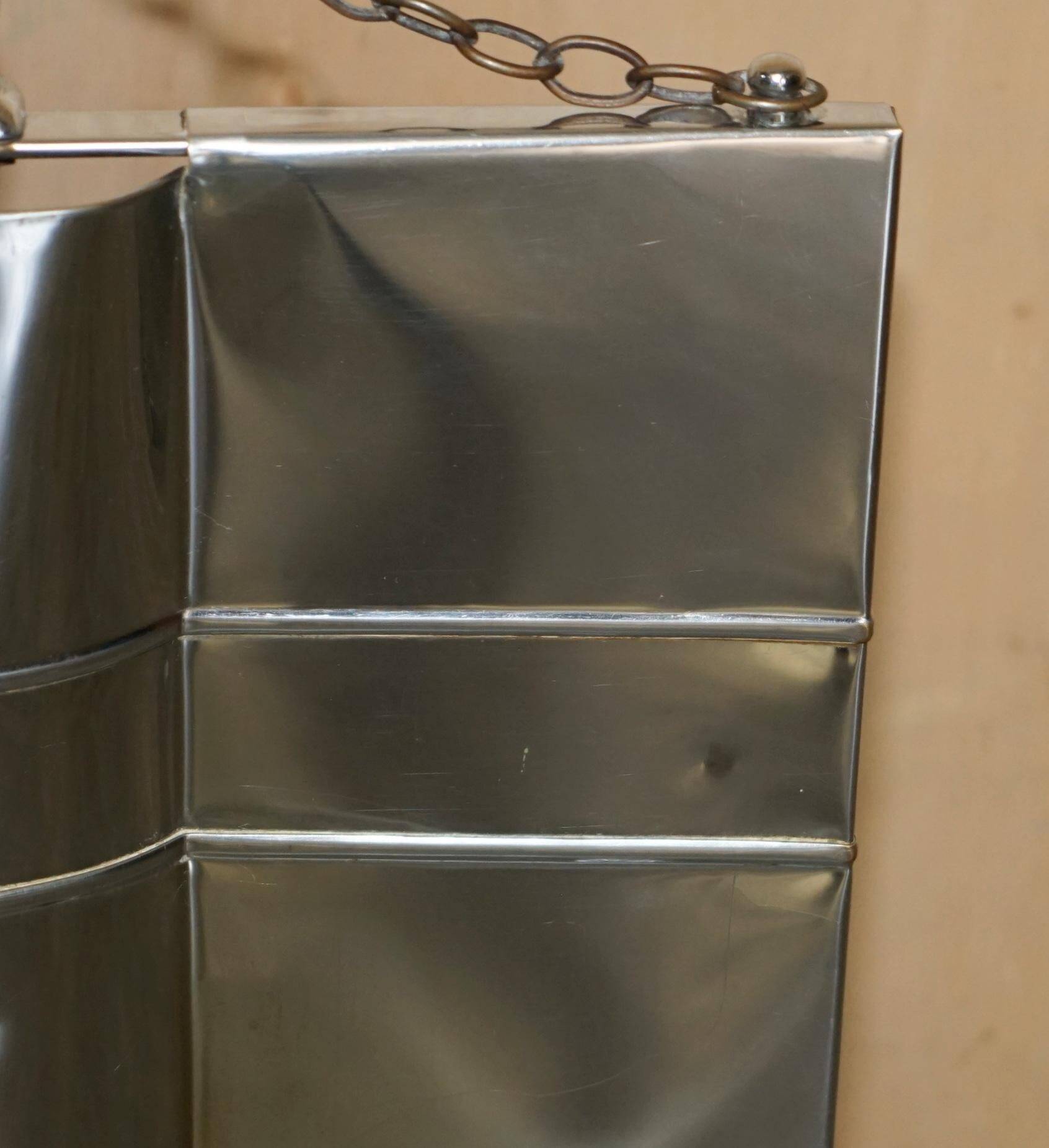 Art Deco fire screen from around 1920 in polished chrome with a bear.