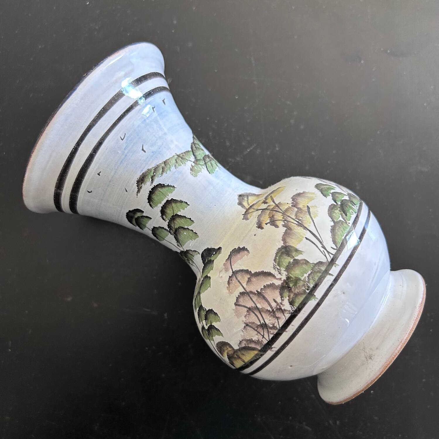 White vase with plant decoration