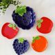 bowls and cups in slipware fruits
