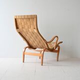 Fauteuil et repose-pieds « Pernilla » conçus par Bruno Mathsson