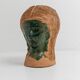 Vintage ceramic vase from the 1980s, sculptural head shape with a green glazed face, terracotta art object.