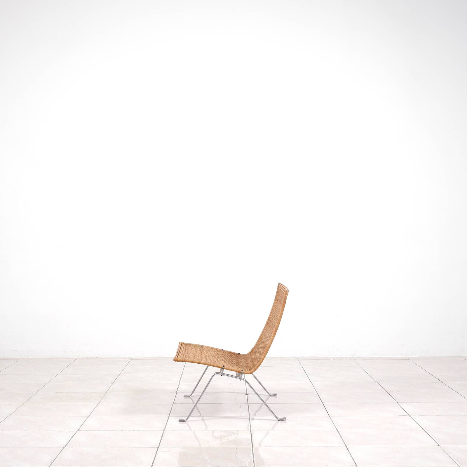 PK 22“ lounge chair in rattan by Poul Kjaerholm for E. Kold Christensen
