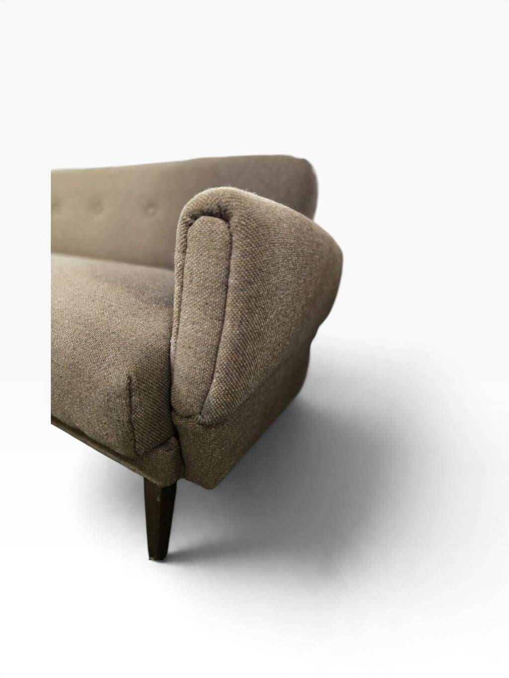 Vintage armchair/sofa/lounge in taupe colour with a stain.