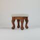 Unique sculpted stools, freshly upholstered and exquisite.