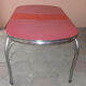 Vintage table of the 60s in red formica and chrome legs