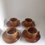 Stoneware coffee cups and saucers