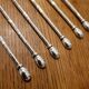 6 long silver-plated metal spoons