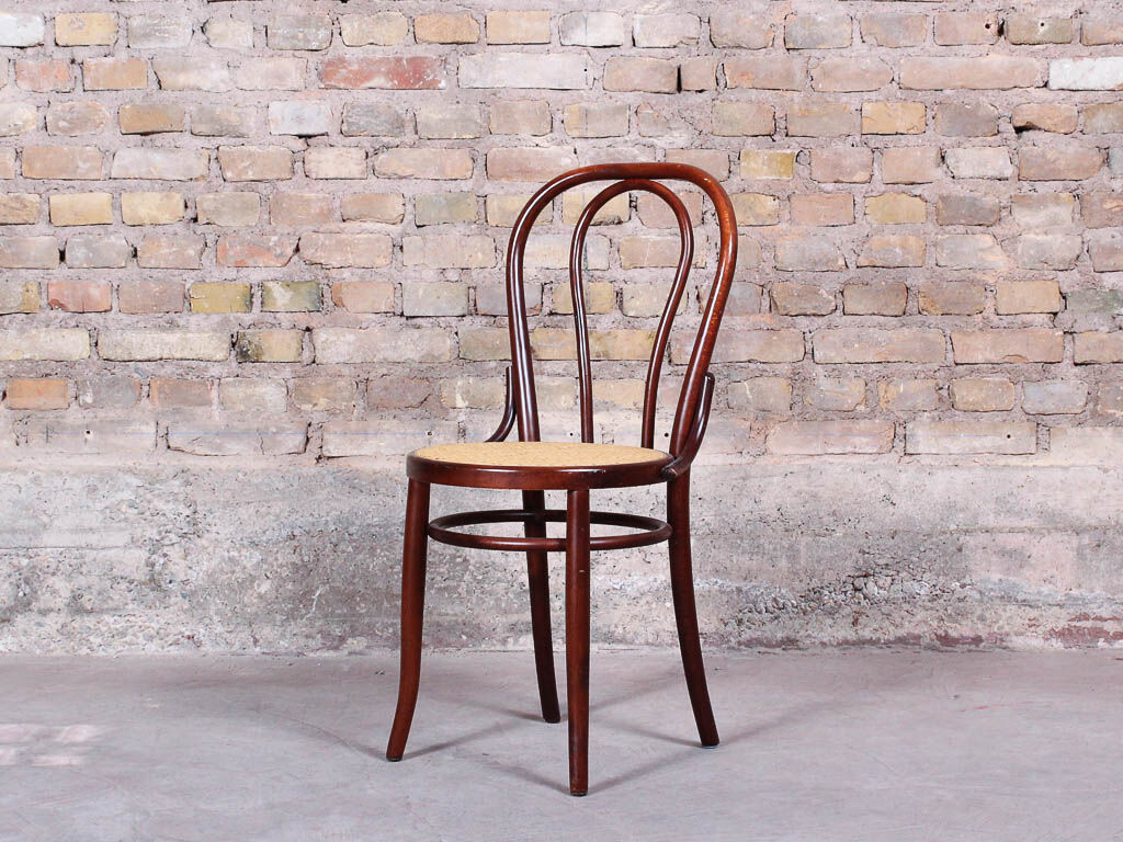 Curved wooden chair and tuna-