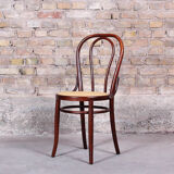 Curved wooden chair and tuna-