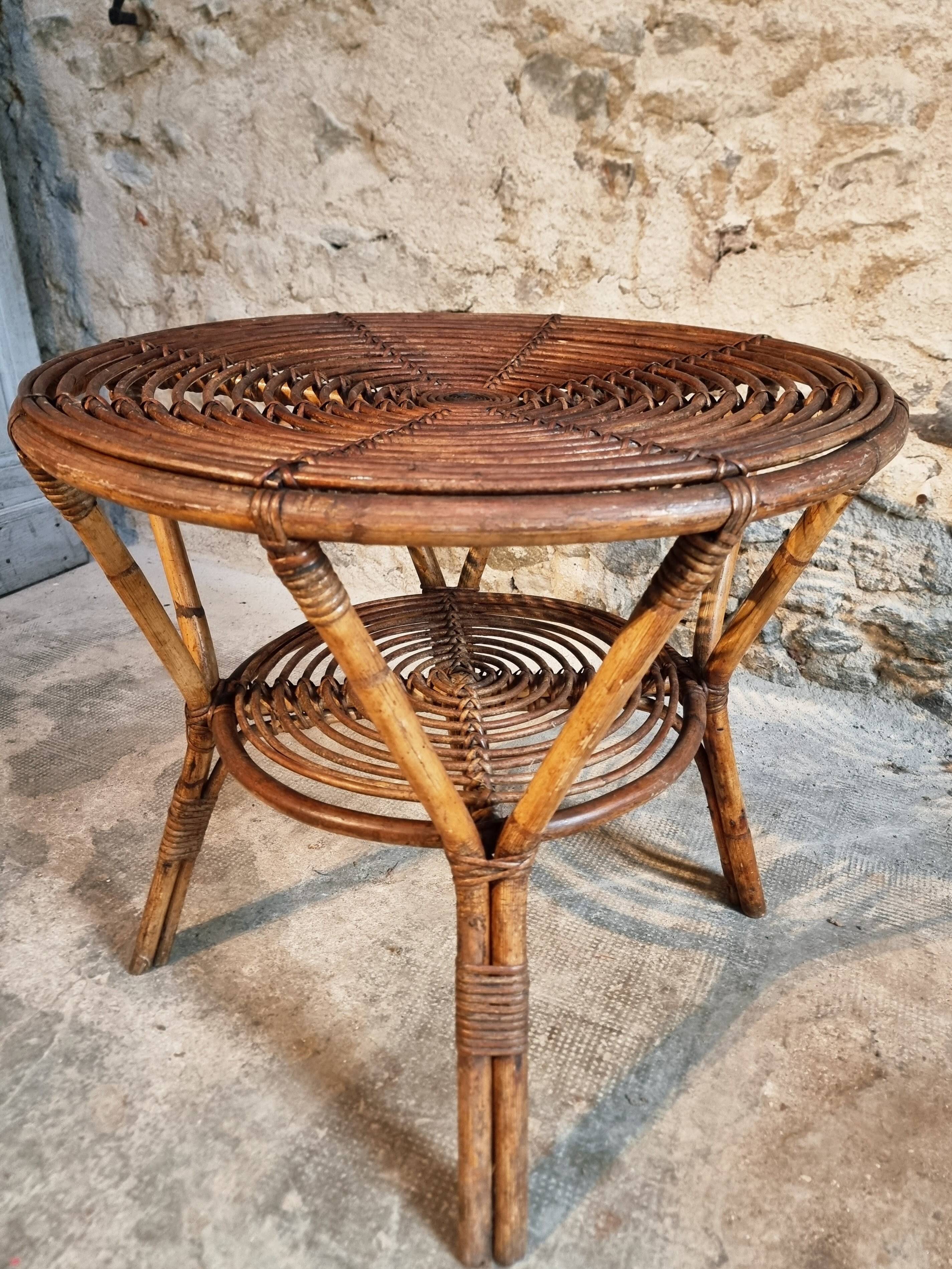 Vintage rattan lounge set, French wicker armchairs and round table, circa 1930–1950.