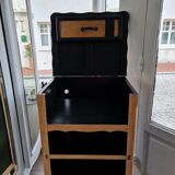 Raw oak and matte black storage cabinet on stencil top and transfer