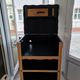 Raw oak and matte black storage cabinet on stencil top and transfer