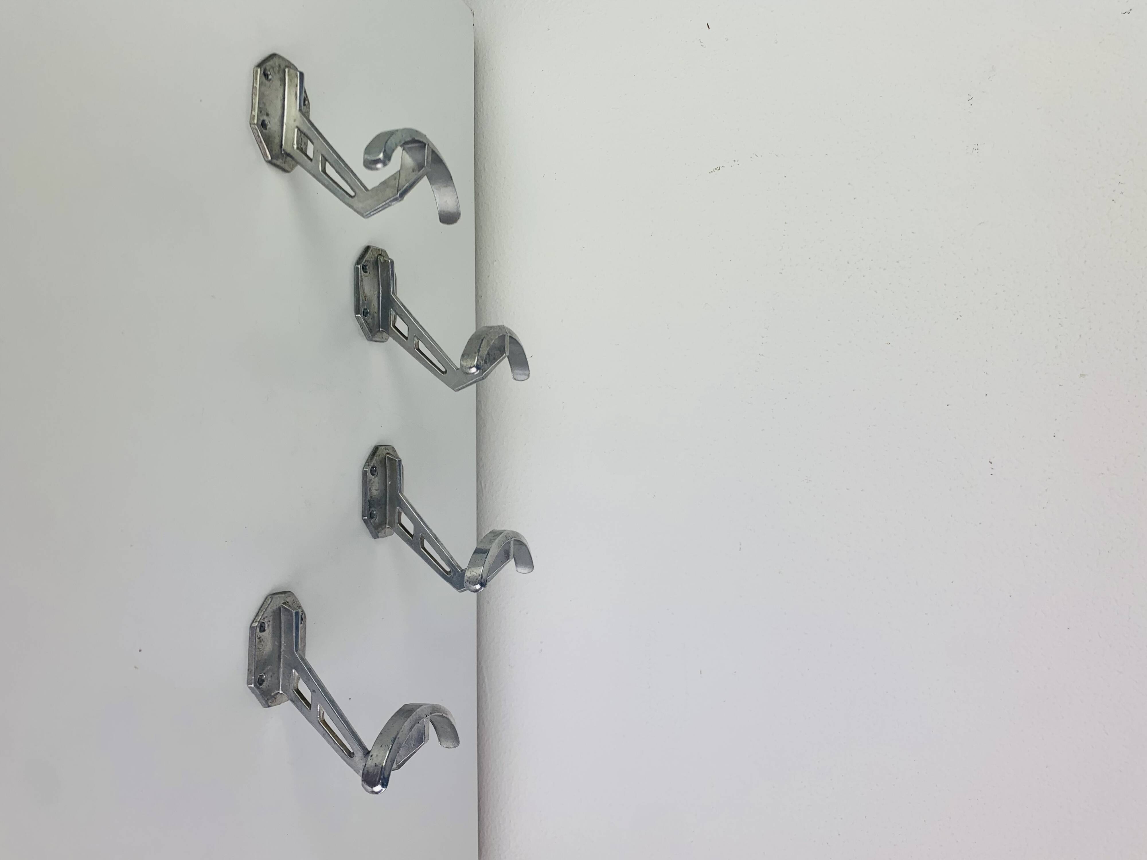 4 wall hooks in aluminium, 1950s
