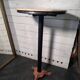 Bistro standing table with marble top and cast iron base.