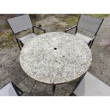 Garden furniture in stone with a vintage 1970s iron base.