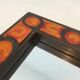 Ceramic mirror in shades of orange