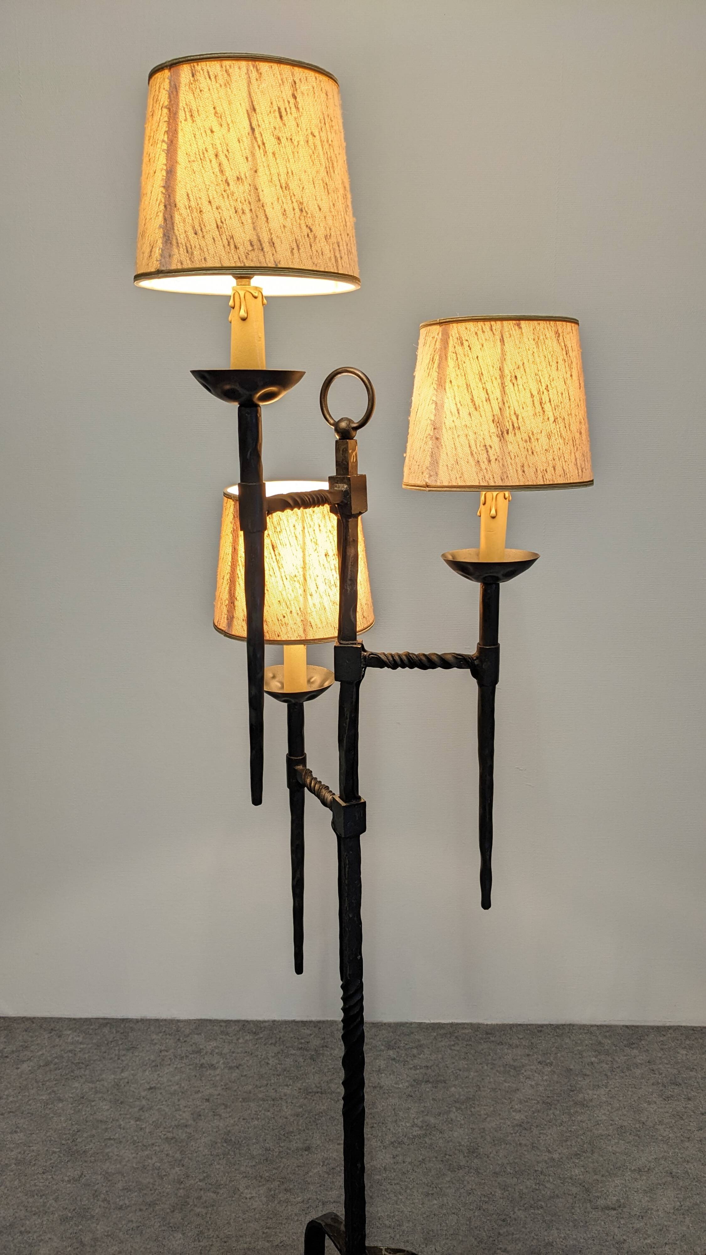 Brutalist tripod floor lamp with 3 lights in wrought iron, France circa 1950.